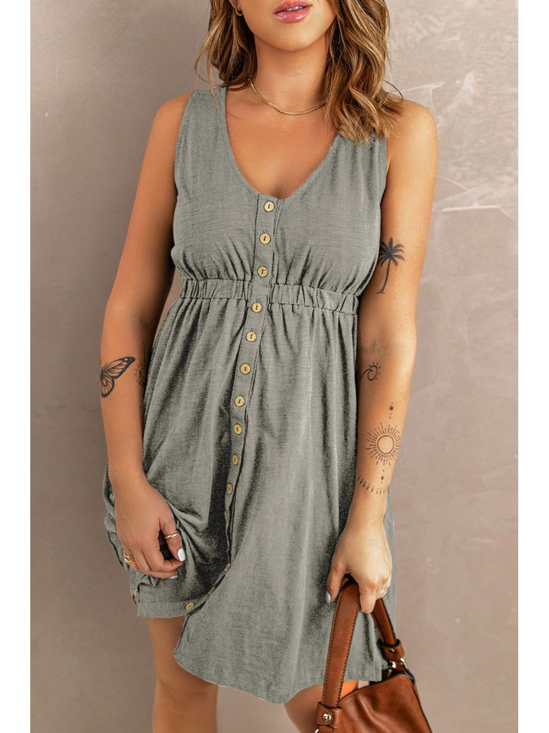 Front walking shot of black sleeveless button down dress – Voguelle