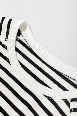 Model wearing striped round neck sweatshirt with side slit – Voguelle