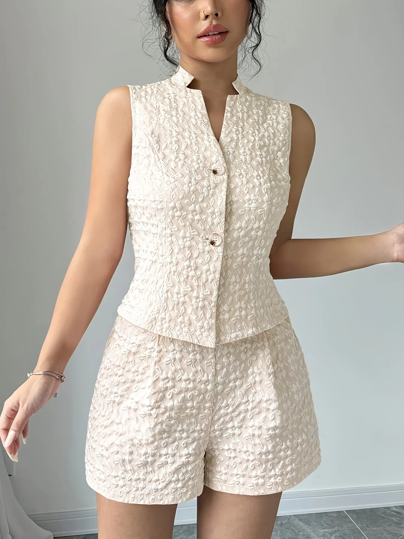 Model styling cream sleeveless vest and shorts co-ord – Voguelle