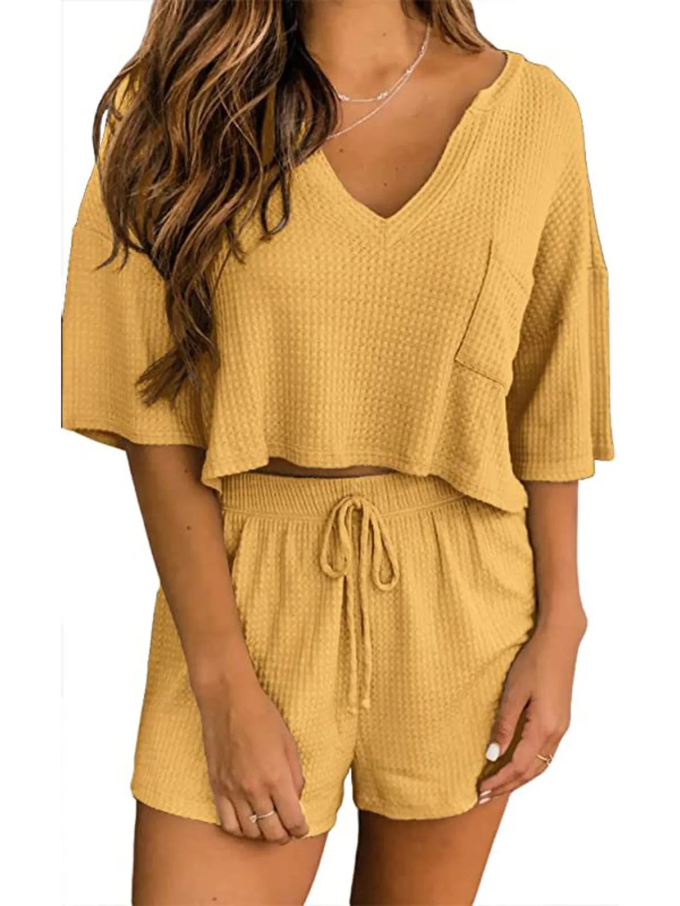 Back view of waffle knit two-piece lounge set in mustard yellow on model – Voguelle