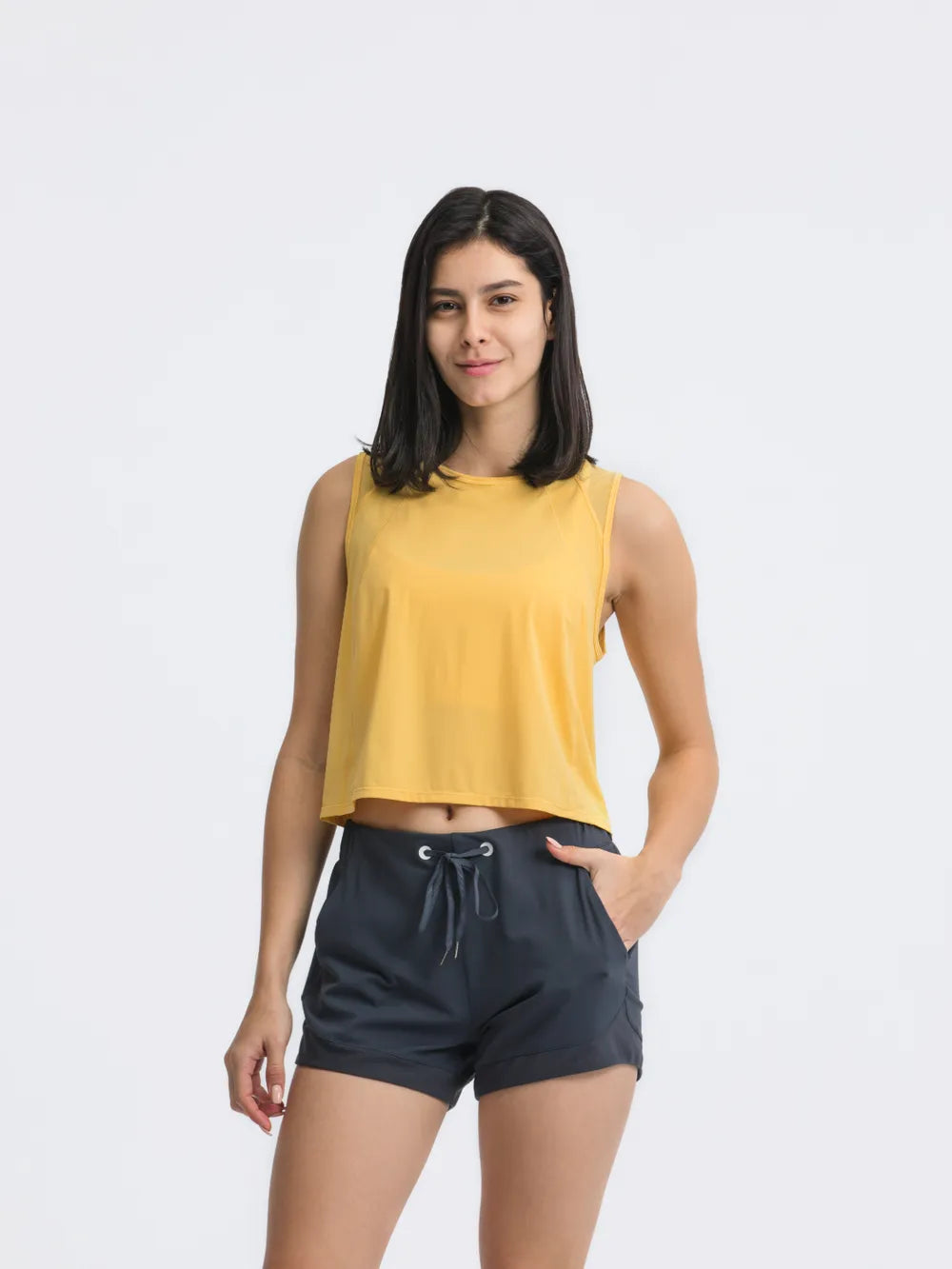 Rear detail of Millennia Cropped Active Tank in yellow – Voguelle