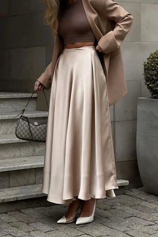 Side view of champagne satin midi skirt styled with blazer and white heels – Voguelle