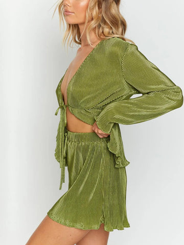 Stylish pleated green co-ord featuring deep neckline and long sleeves – Voguelle