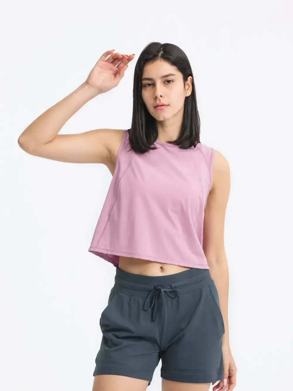 Front view of Millennia Cropped Active Tank in pink on model – Voguelle
