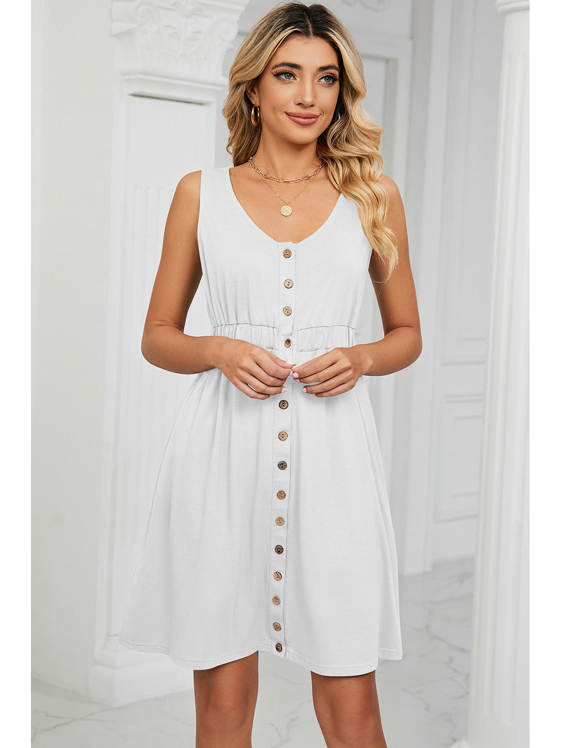 Model posing in ruffled mini dress – Voguelle