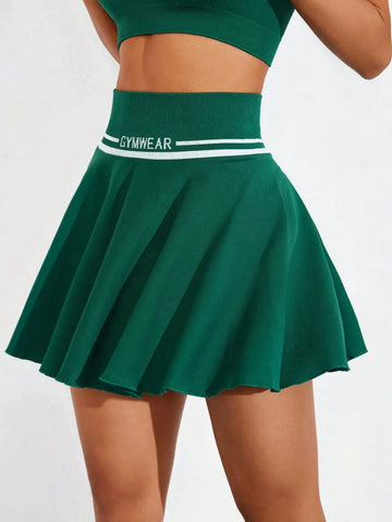 Side view of green ruched high waist mini active skirt showing silhouette on model – Voguelle