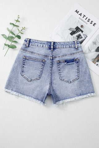 Flat lay back view of pearl studded raw hem shorts – Voguelle
