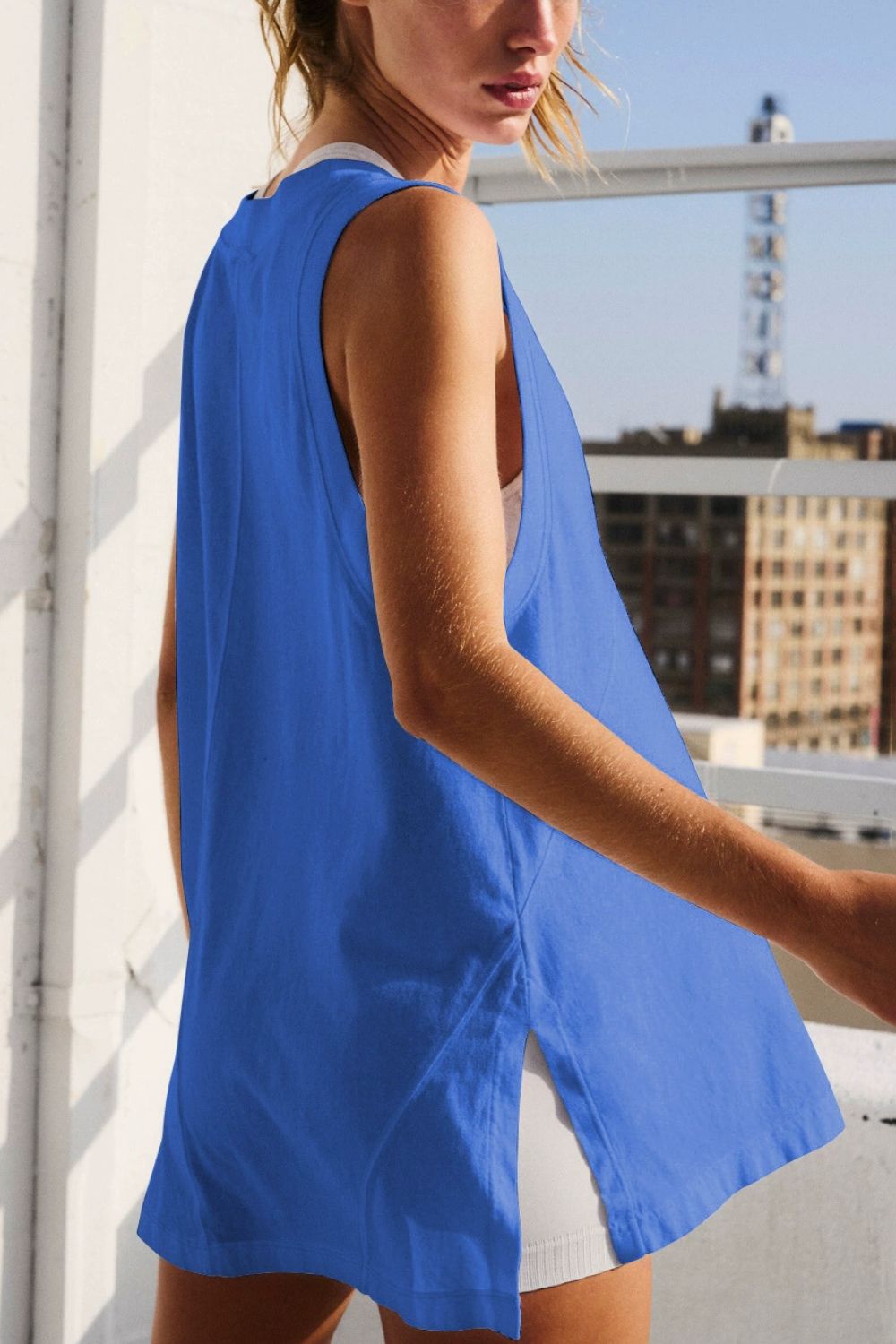 Back view of styling sleeveless blue slit tank – Voguelle