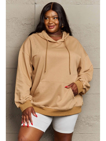 Side angle of women’s camel hoodie with kangaroo pocket – Voguelle