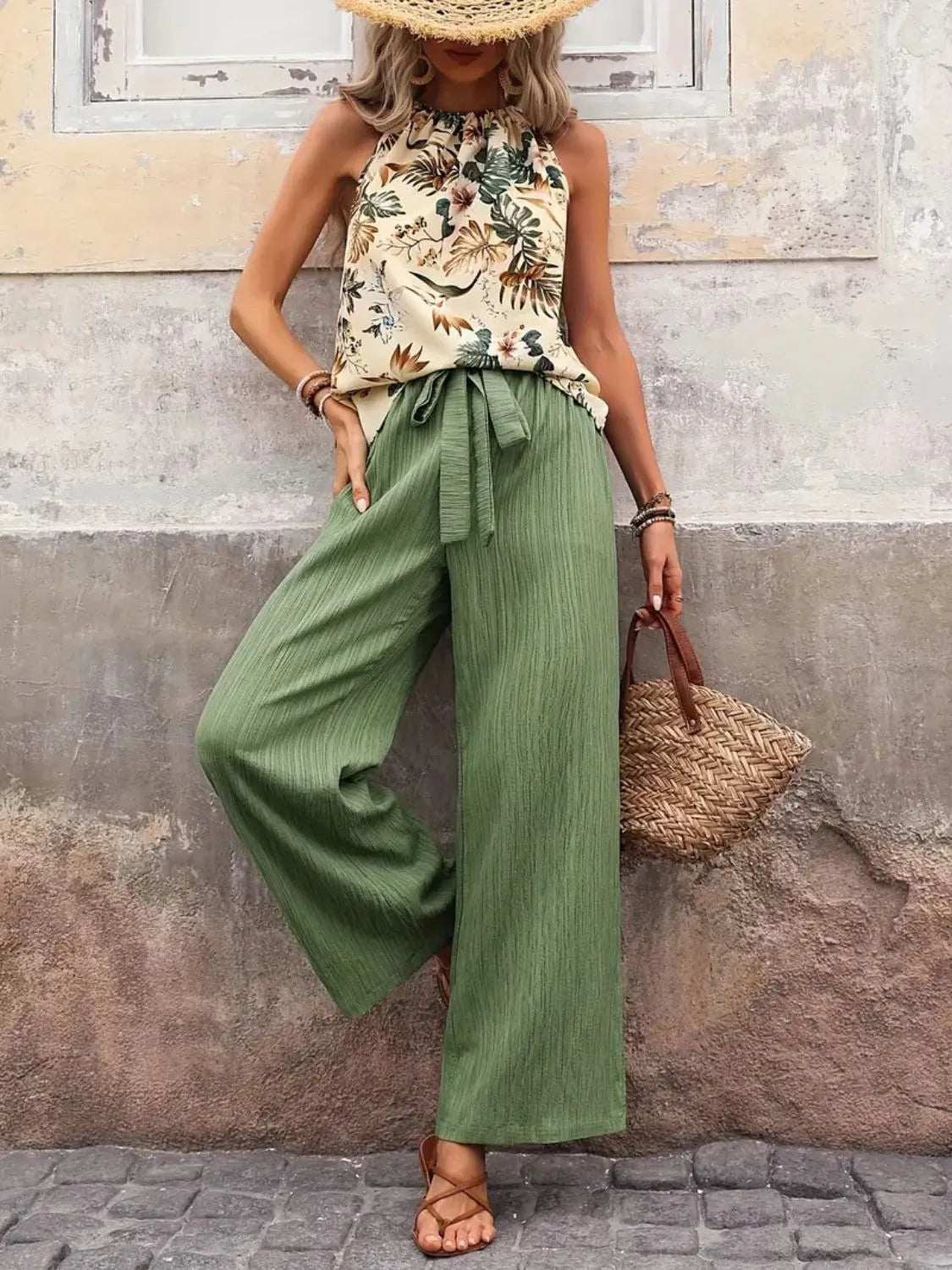 Printed floral blouse tucked into wide leg green pants – Voguelle