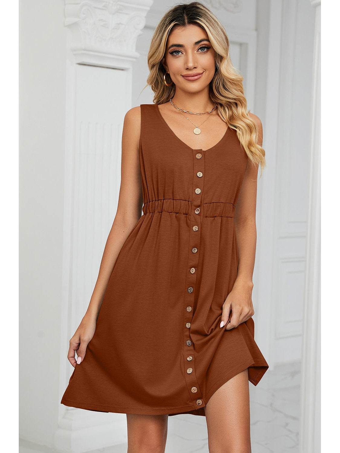 Side view of sleeveless button-down dress – Voguelle