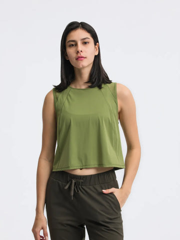 Front view of Millennia Cropped Active Tank in green on model – Voguelle