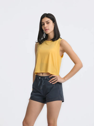Side angle of Millennia Cropped Active Tank in yellow – Voguelle