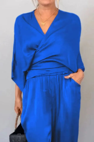 Black wrap surplice jumpsuit with V-neck and flowy pants – Voguelle