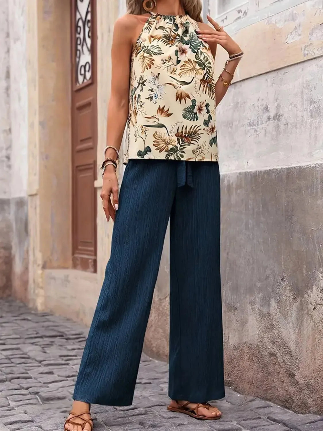 Printed floral blouse tucked into wide leg green pants – Voguelle