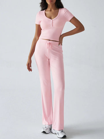 Pink ribbed button-front crop top styled with high-waist drawstring pants – Voguelle