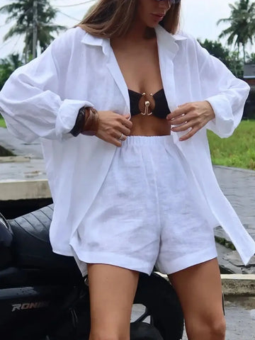 Model holding tote bag in pink button-up shirt and shorts set – Voguelle