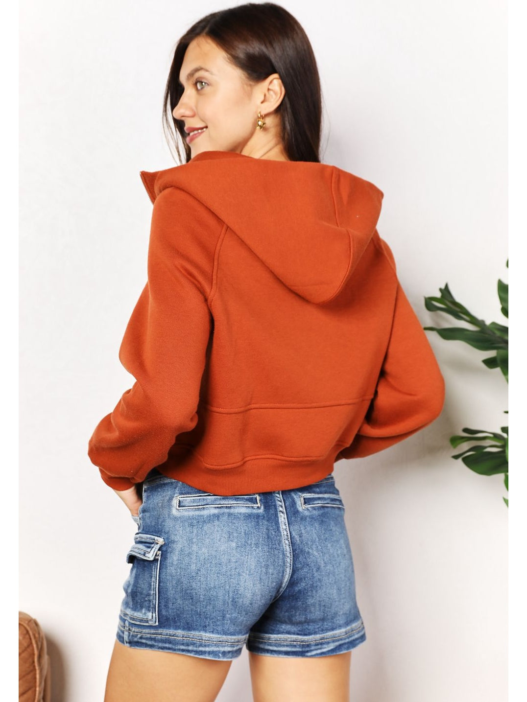 Back view of rust cropped half-zip hoodie – Voguelle