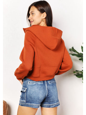 Back view of rust cropped half-zip hoodie – Voguelle