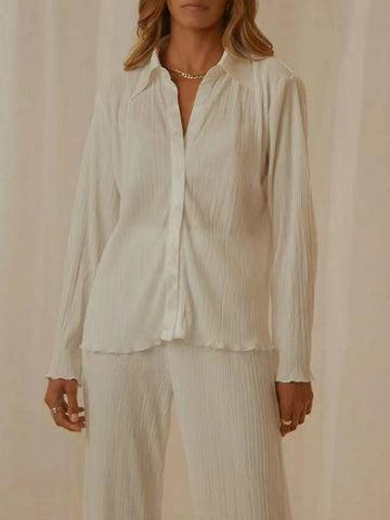 Front detail of long sleeve button-up orange top – Voguelle
