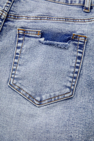 Close-up waistband detail of pearl studded denim shorts – Voguelle