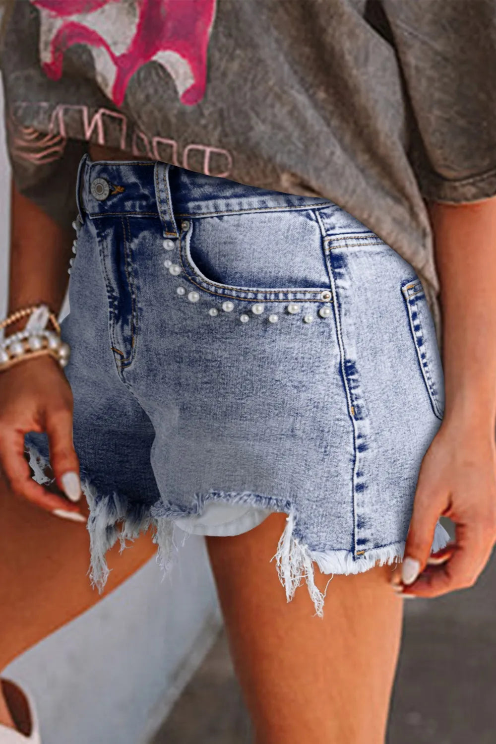 Model styling pearl studded raw hem denim shorts – Voguelle