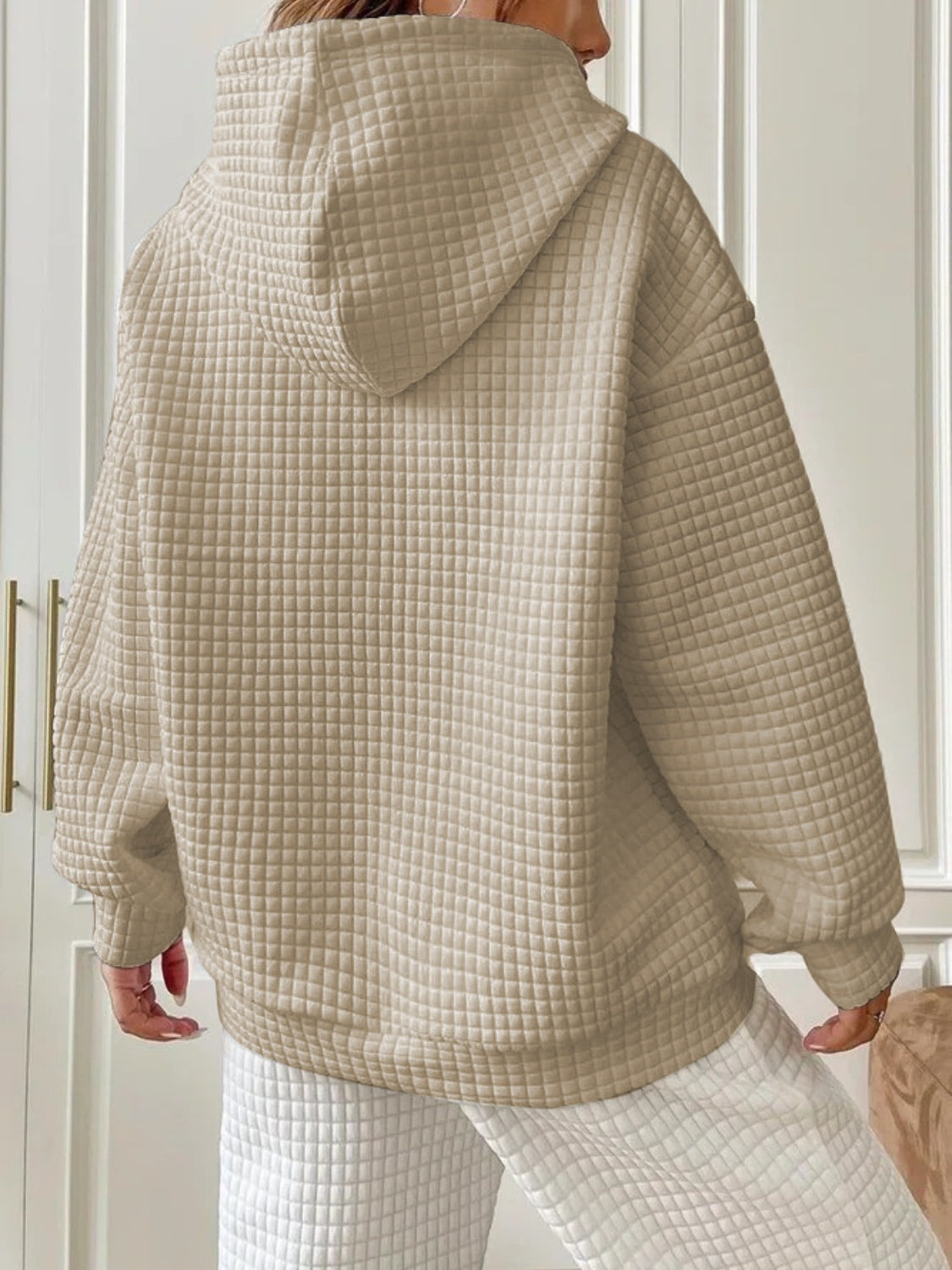 Side profile beige textured hoodie on model – Voguelle