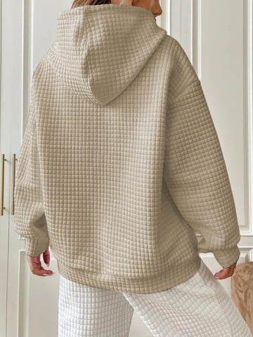 Side profile beige textured hoodie on model – Voguelle