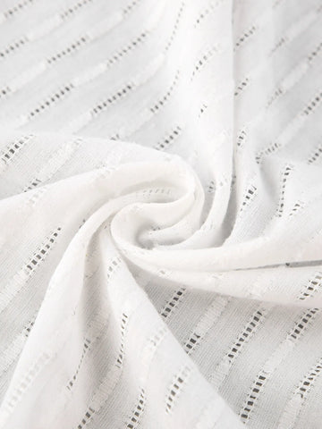 Close-up of sleeve detail on textured cotton shirt – Voguelle
