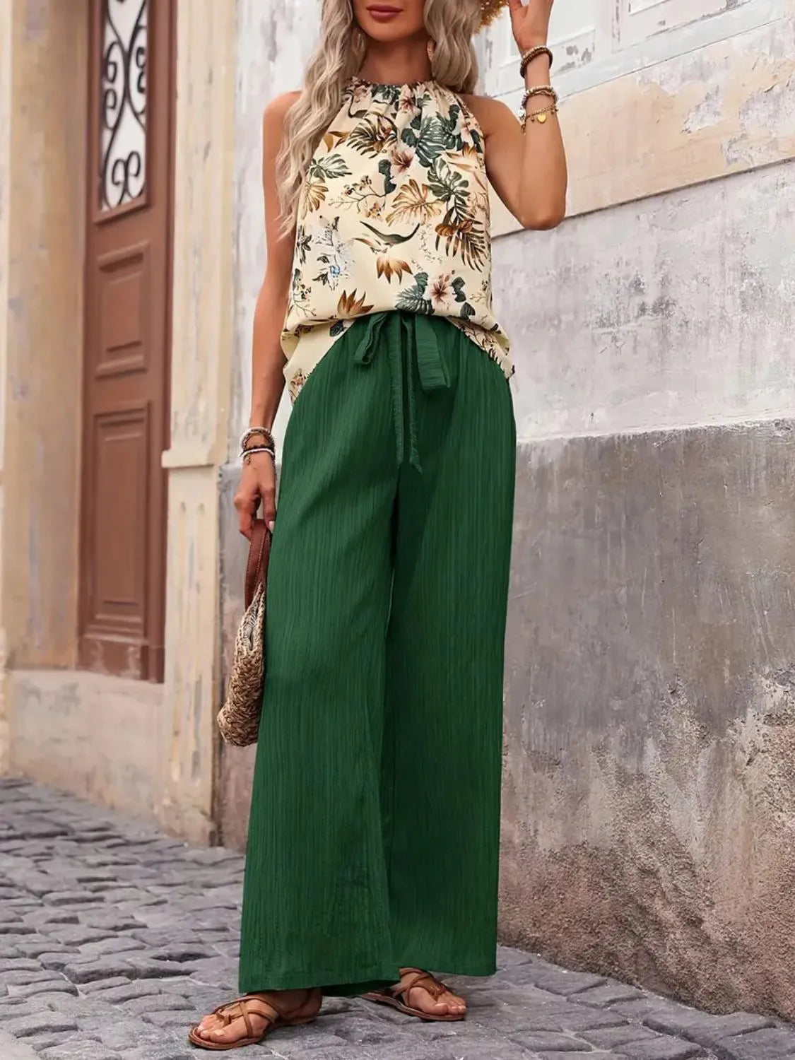 Printed floral blouse tucked into wide leg green pants – Voguelle