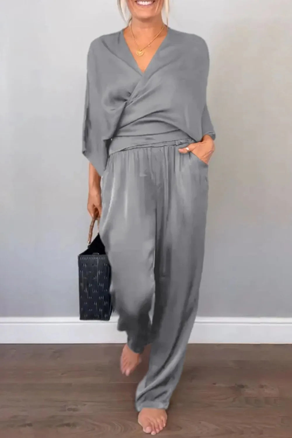 Black wide-leg jumpsuit with flattering wrap neckline – Voguelle