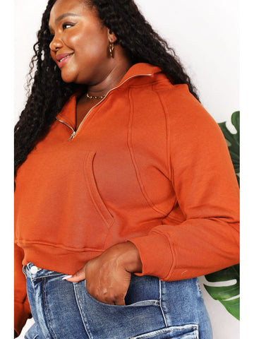 Cozy rust cropped hoodie with zipper detail on model – Voguelle