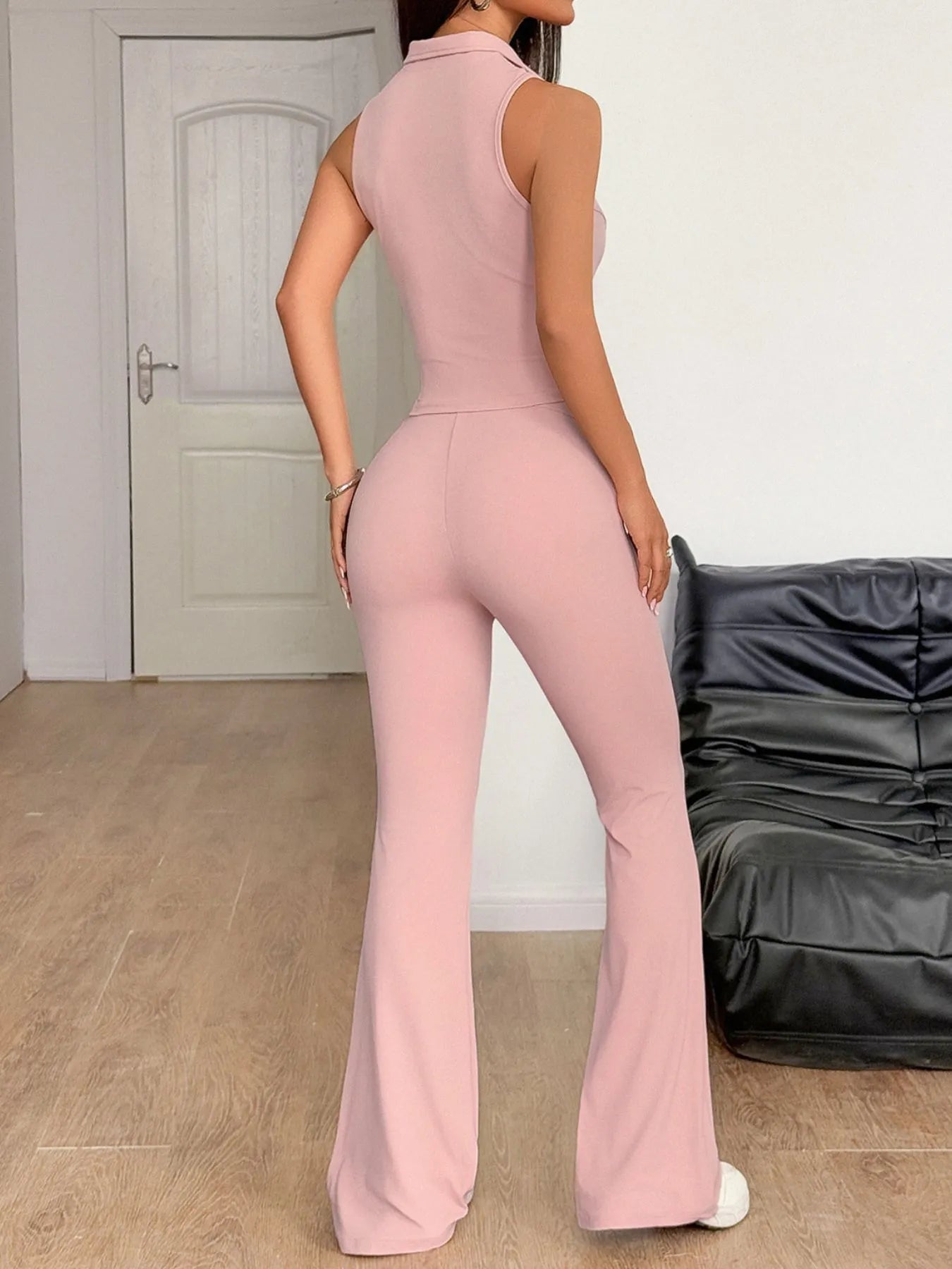 Front view of pink sleeveless zip front top and pants set on model – Voguelle