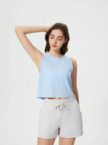 Model wearing Millennia Cropped Active Tank in beige – Voguelle
