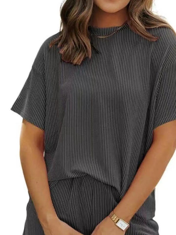 Model showcasing Plus Size Ribbed Lounge Shorts Set in chic summer style – Voguelle
