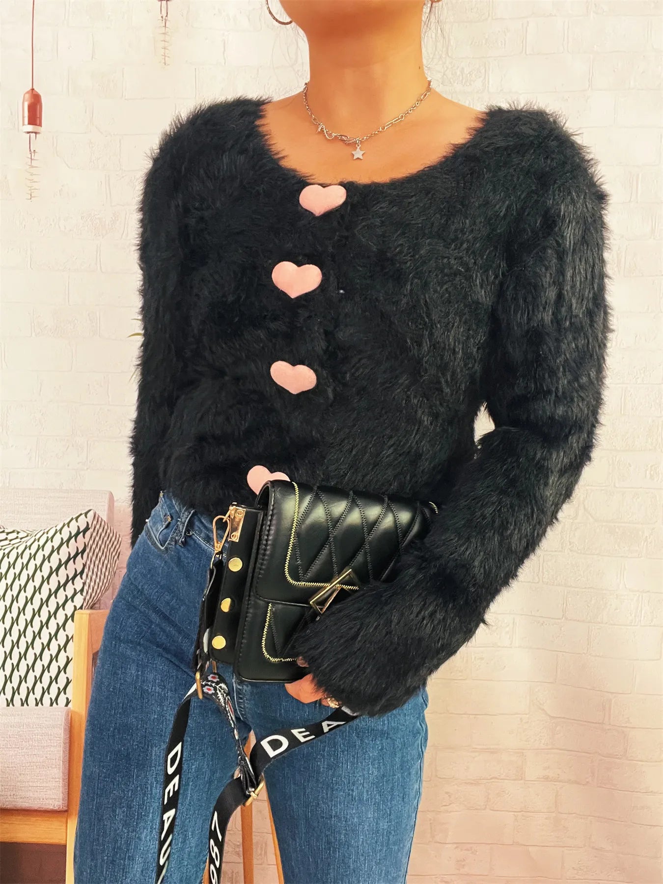 Angled view of black Fuzzy Heart Shape Button-Up Cardigan – Voguelle