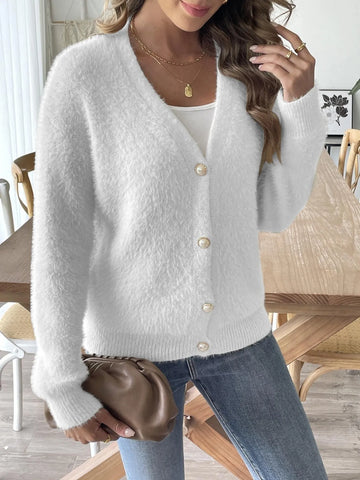 Close-up of button-front detail on white fuzzy cardigan – Voguelle