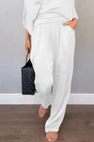 Casual chic black surplice jumpsuit with short sleeves – Voguelle