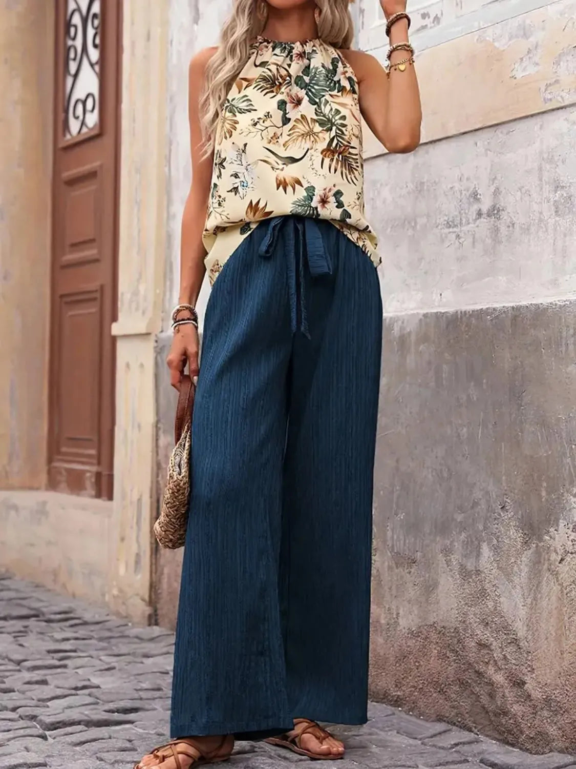 Side pose printed blouse with green wide leg trousers – Voguelle