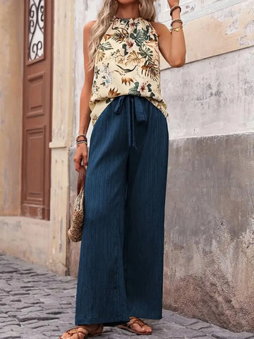 Side pose printed blouse with green wide leg trousers – Voguelle
