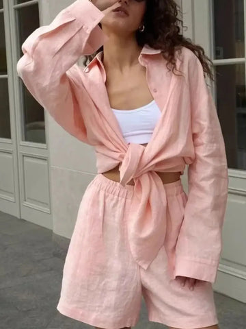 Close-up of collar and sleeve detail on pink button-up shirt – Voguelle