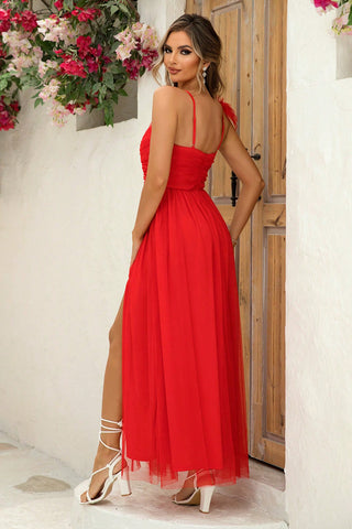 Front pose of blue ruched slit maxi dress styled with heels – Voguelle