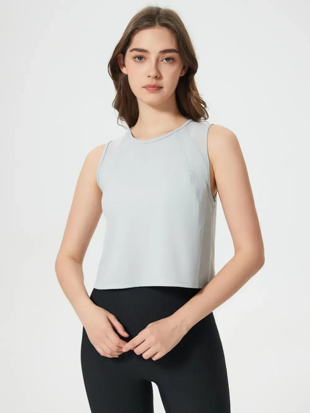 Rear angle of Millennia Cropped Active Tank in white on model – Voguelle