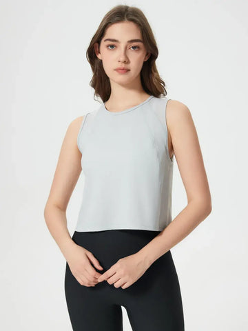 Rear angle of Millennia Cropped Active Tank in white on model – Voguelle