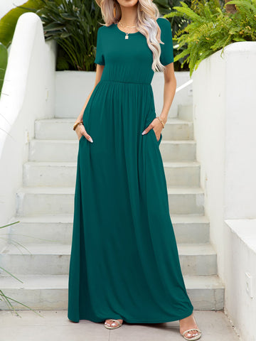 Model in green pocket maxi dress – Voguelle