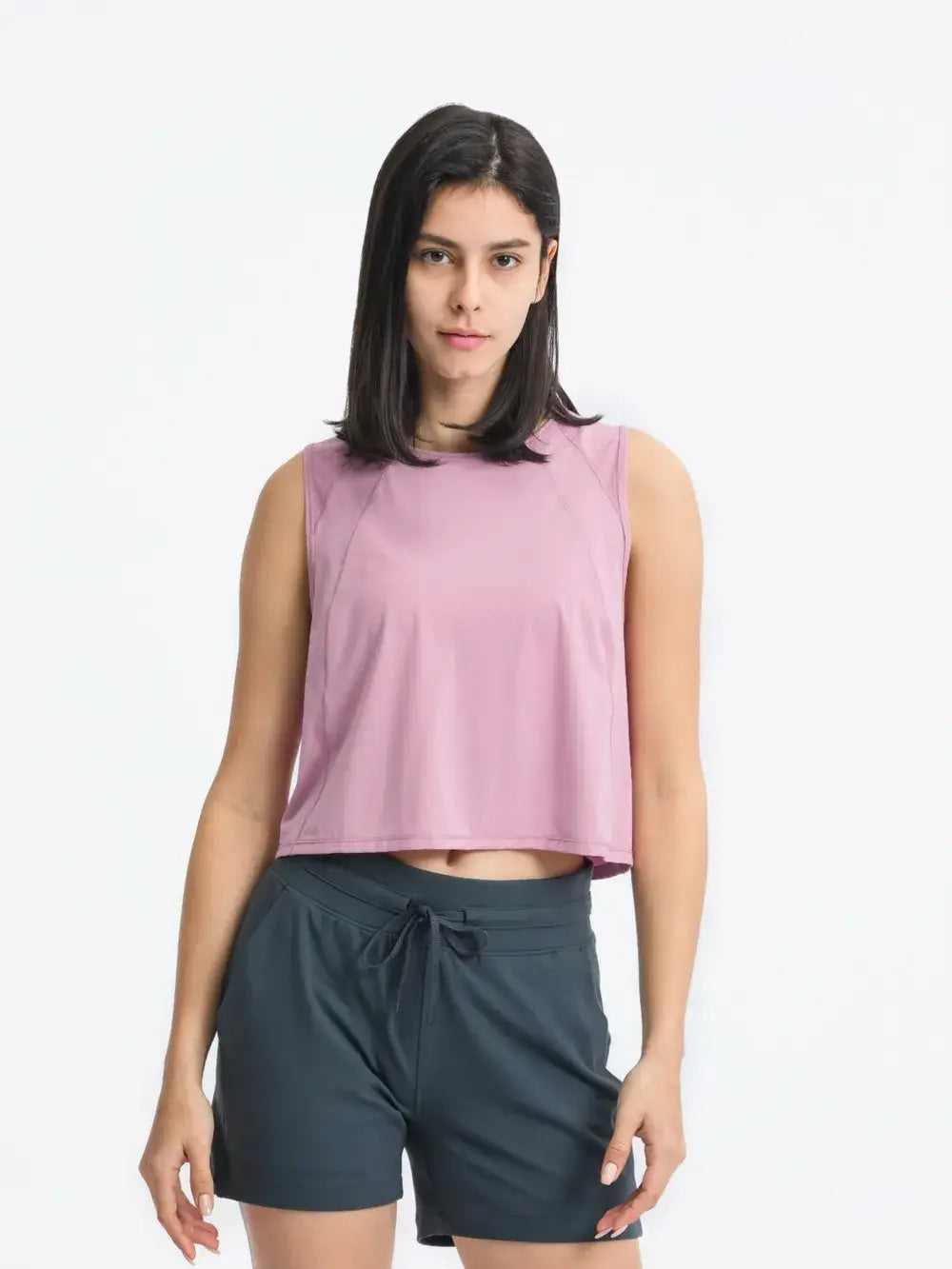 Model wearing Millennia Cropped Active Tank in pink – Voguelle