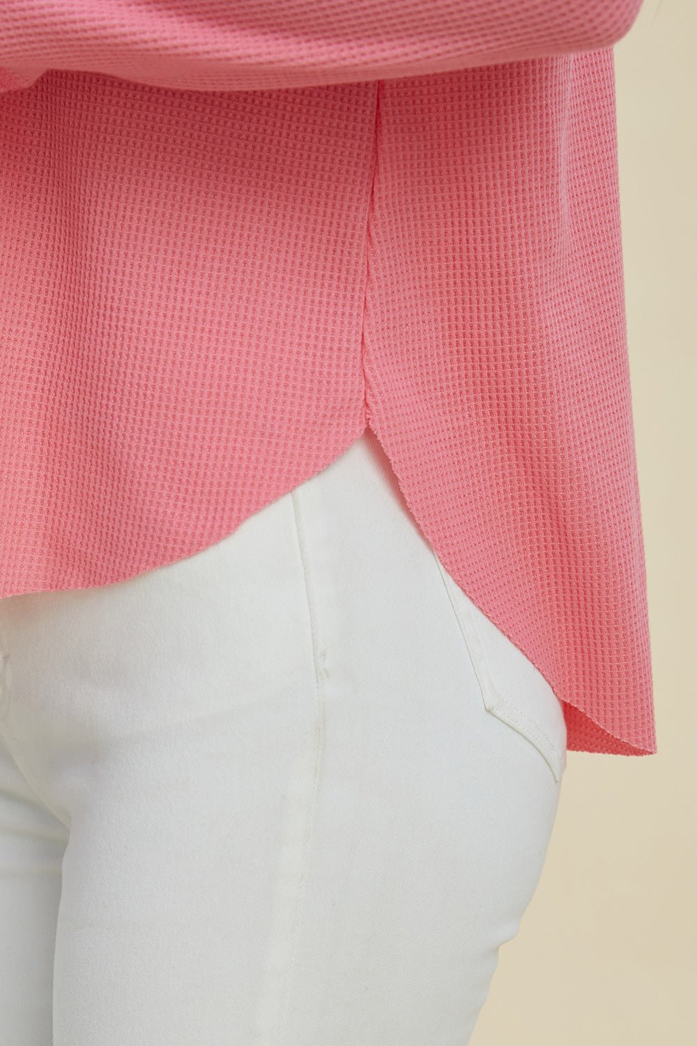 Front view of pink hooded long sleeve top on model – Voguelle