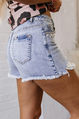 Flat lay back side of pearl studded raw hem shorts – Voguelle