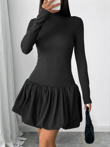 Black long sleeve bubble hem dress walking pose – Voguelle