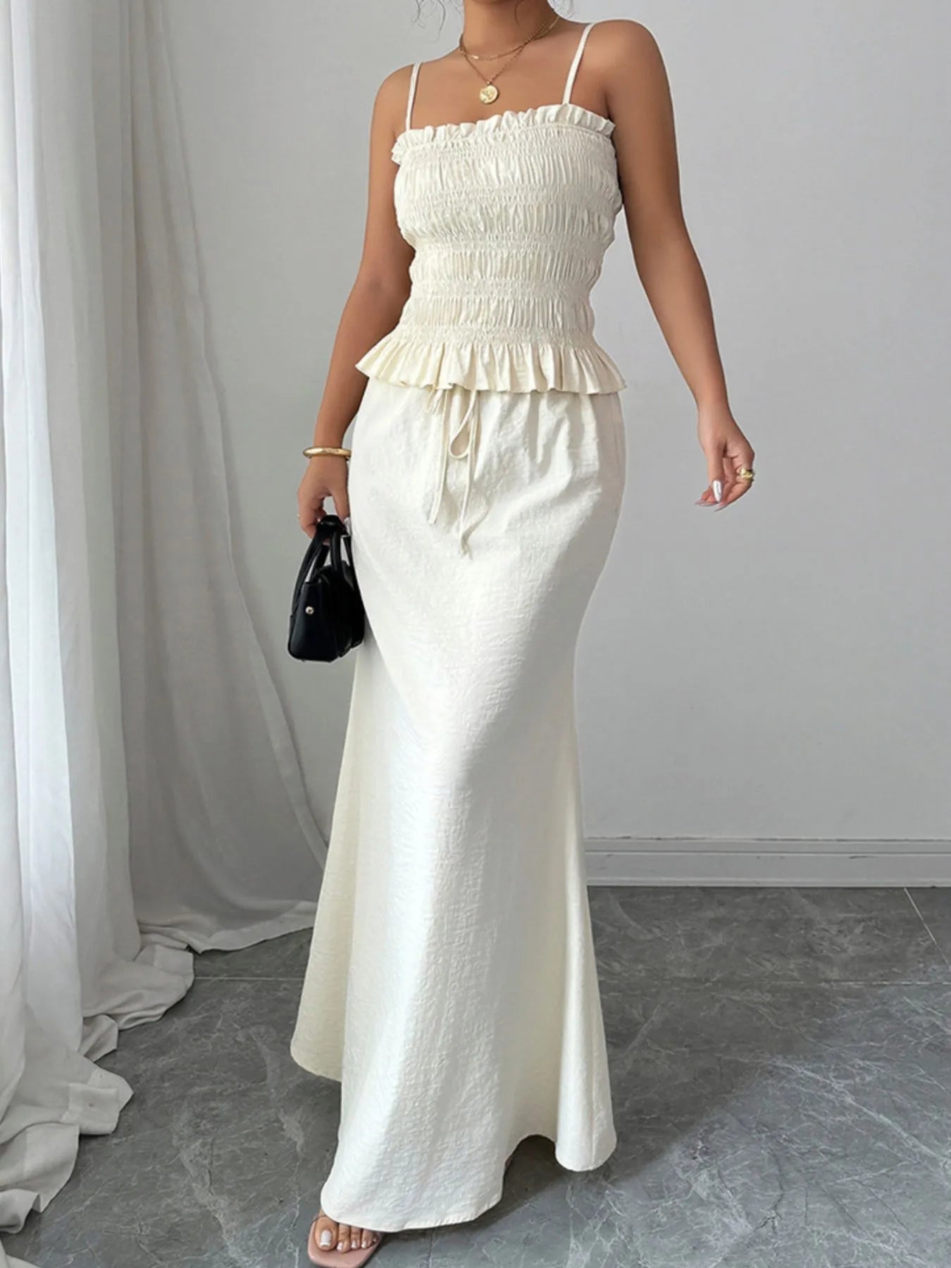 Model in white sleeveless cami top and maxi skirt – Voguelle